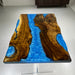golden camphor wood coffee table featuring blue epoxy