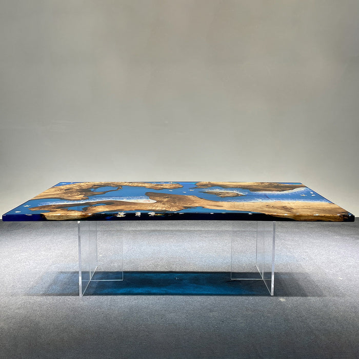 Dining table with blue and brown design on a gray floor and wall