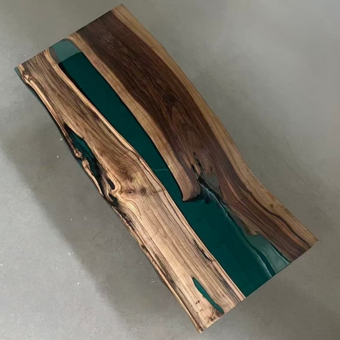 Green epoxy live edge dining table with rich walnut grain