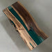 Green epoxy live edge dining table with rich walnut grain