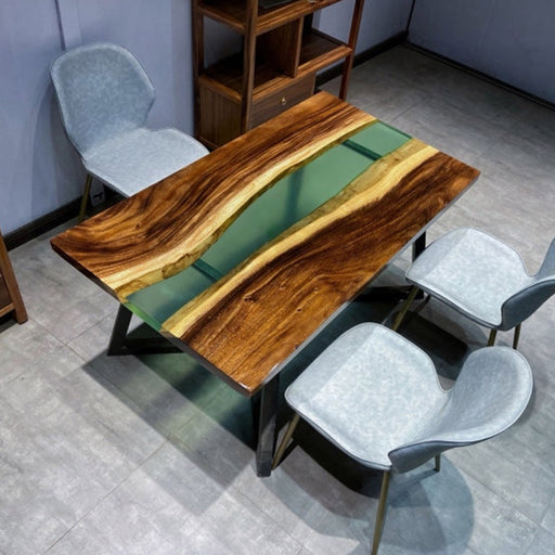 Custom-made live edge wood dining table featuring a unique green resin centerpiece, designed for stylish interiors that value craftsmanship and elegance.