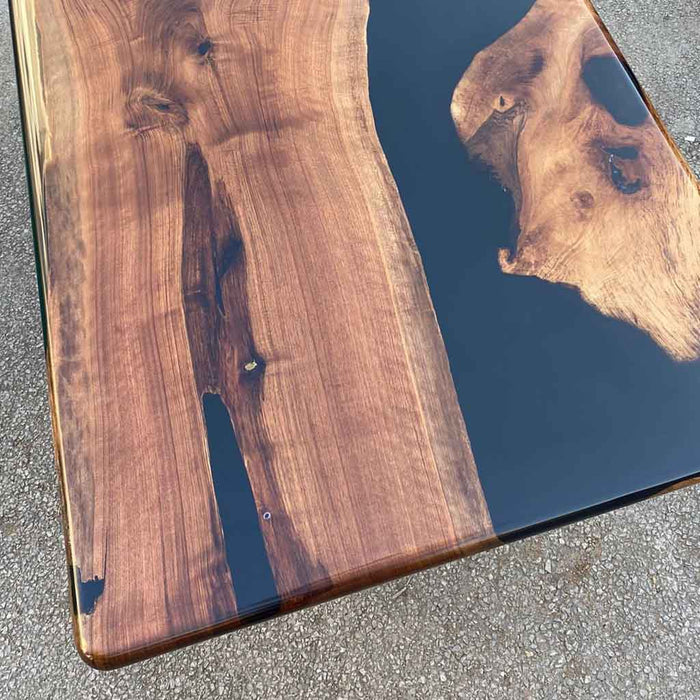 Handcrafted black epoxy coffee table with walnut top