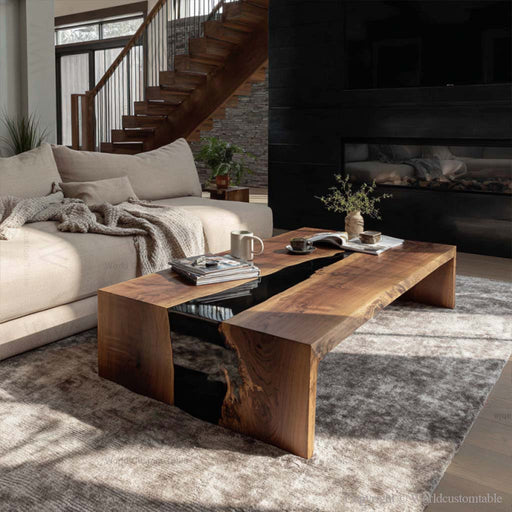 Handcrafted black resin epoxy coffee table next to modern sofa