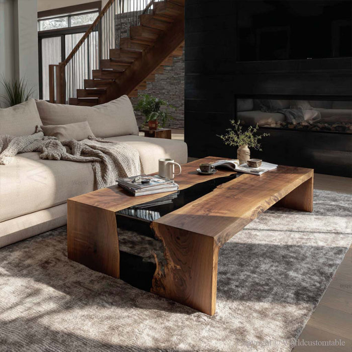 Handcrafted black resin epoxy coffee table next to modern sofa