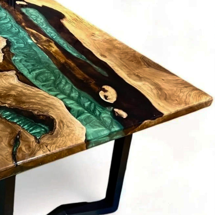 Wooden table with green and gold resin inlay on a white background