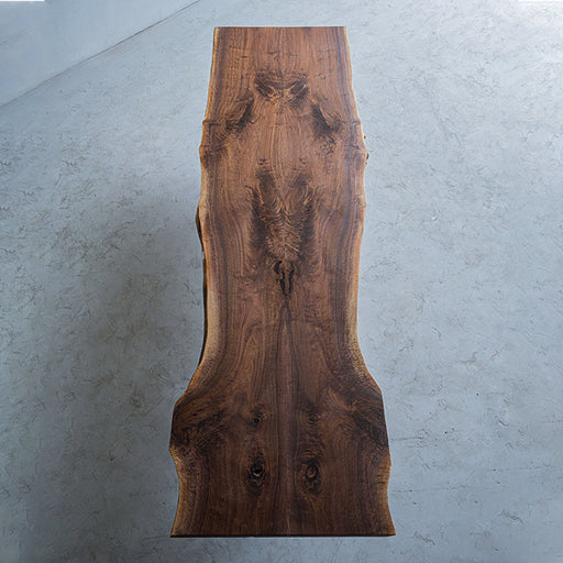 Handcrafted black walnut live edge dining table with smooth polished surface