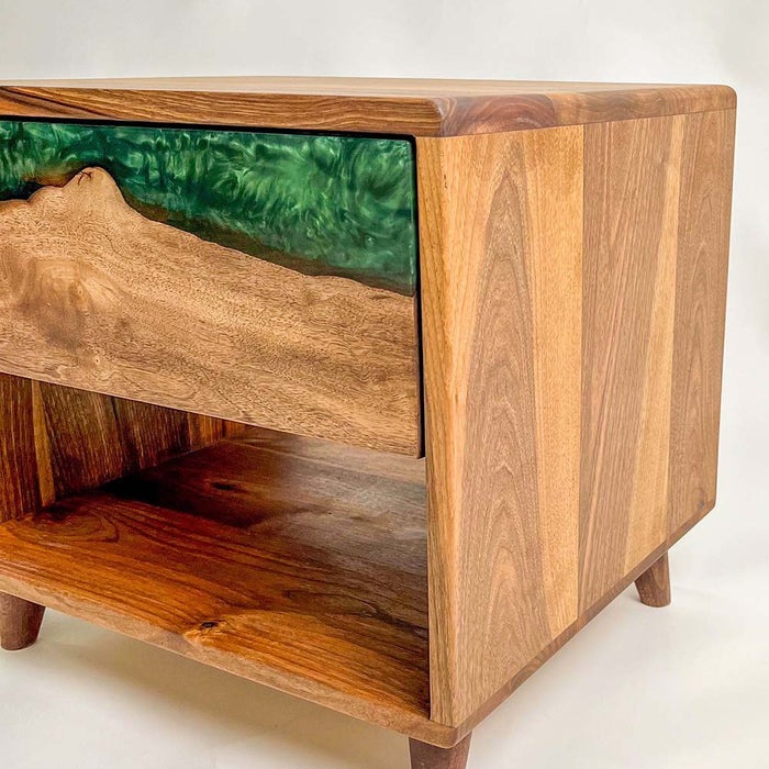 Handcrafted epoxy bedside table made from walnut and green resin.