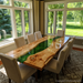 Handcrafted modern epoxy dining table in a bright contemporary kitchen