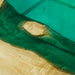 Close-up of a wooden surface with green resin flowing over it
