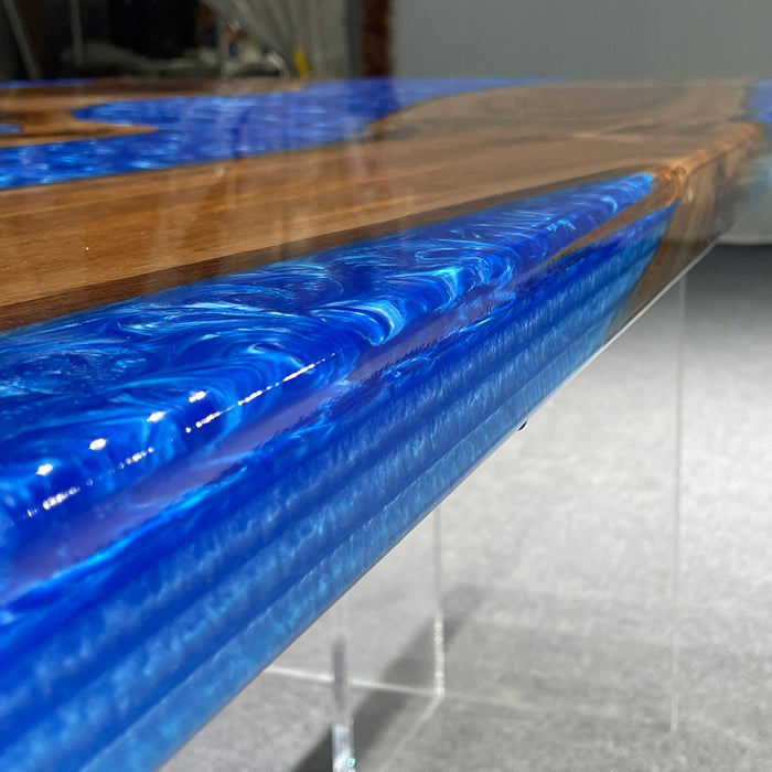 Tabletop with blue resin and wood design on a gray surface
