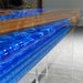Tabletop with blue resin and wood design on a gray surface