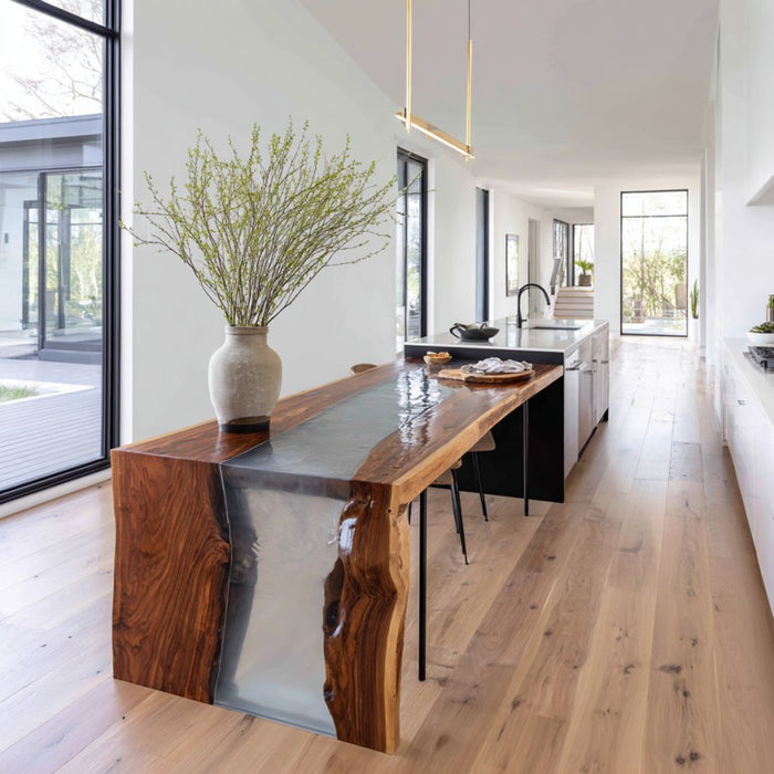 Modern kitchen with a wooden dining table and large windows