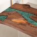 Handcrafted walnut dining table with artistic green epoxy river