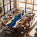 Dining table with blue resin inlay in a modern room