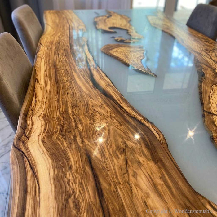 Artisan handcrafted live edge olive wood and epoxy resin table showcasing natural textures and finish