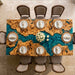 Detailed shot of an ocean-inspired blue resin and burl wood table in a high-end outdoor patio.