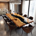 Modern dining room with a long wooden table and chairs in a stylish interior.