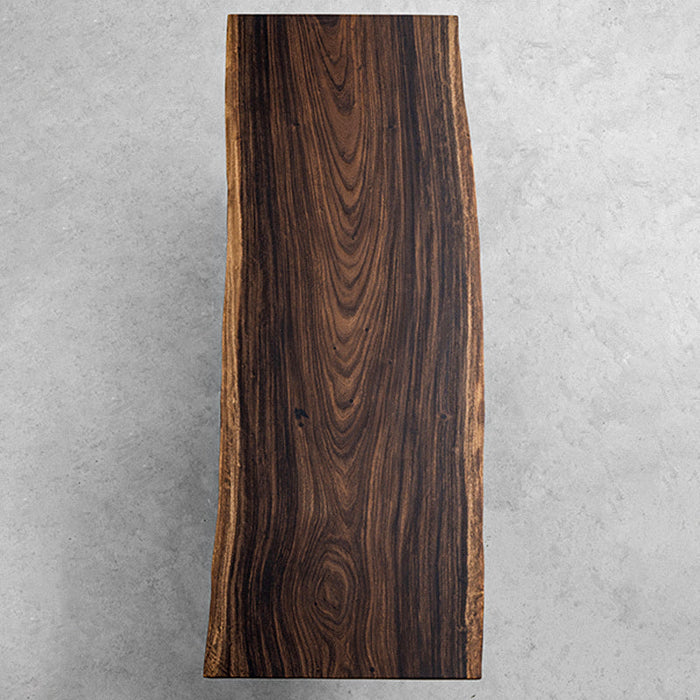 Handcrafted solid wood table using rare South American rain tree, showcasing natural beauty and durability.