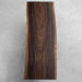 Handcrafted solid wood table using rare South American rain tree, showcasing natural beauty and durability.