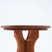Handcrafted round side table in Terminalia wood with modern sculptural base