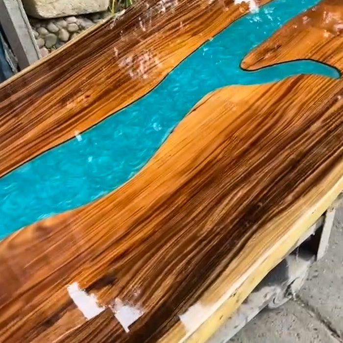 Handcrafted walnut dining table with blue epoxy resin center