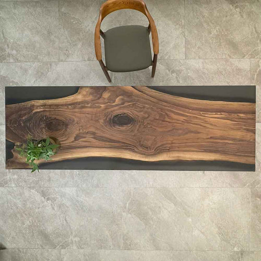 Wooden table with natural grain pattern on a tiled floor