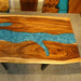 Handcrafted walnut epoxy river dining table for modern homes