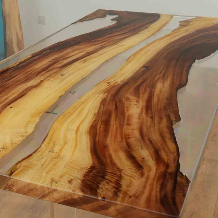 Artistic and luxurious handcrafted walnut epoxy dining table for modern interiors