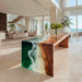 Handcrafted walnut epoxy waterfall table in Miami-style study room