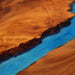 Handcrafted walnut L-shaped countertop with mysterious blue epoxy resin finish