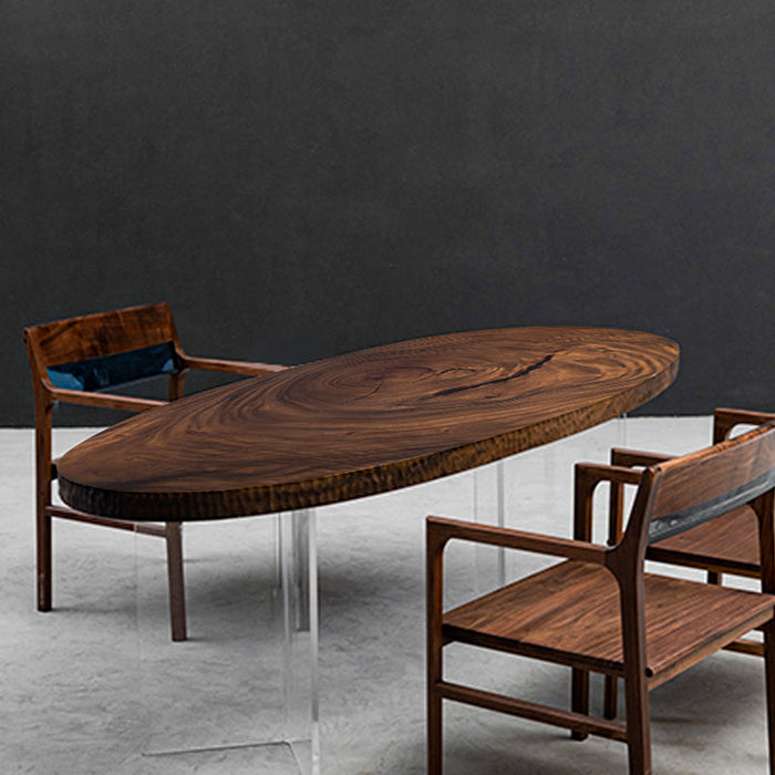 Handcrafted elliptical table featuring natural walnut slabs with live edges.