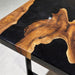 Handcrafted black walnut resin dining table with natural wood grain