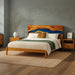 Wooden bed with artistic headboard in a bedroom setting