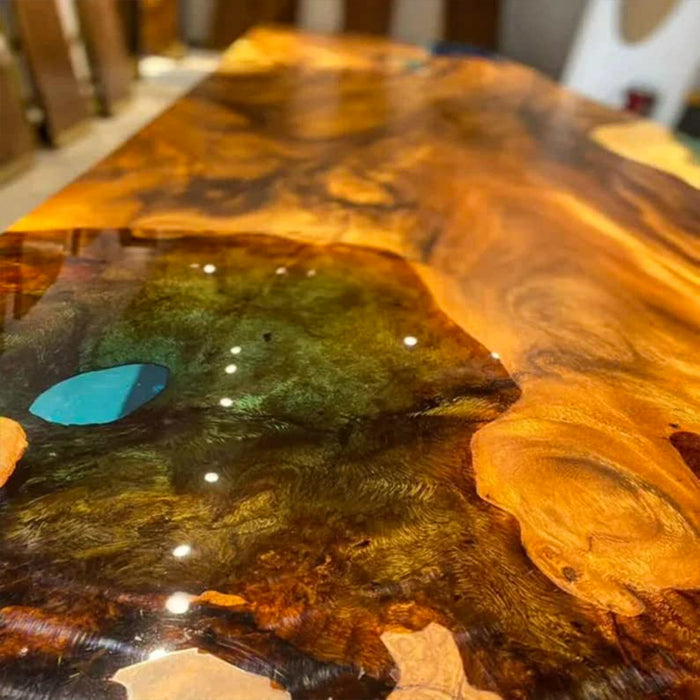 Wooden table with a glossy finish, featuring natural wood grain patterns.