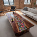 Wooden coffee table with colorful embedded stones in a living room setting