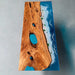 Handcrafted live edge walnut table featuring ocean resin inlay