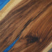 Close-up of a wooden surface with a blue accent