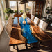 Handcrafted walnut epoxy river table in modern dining room setting