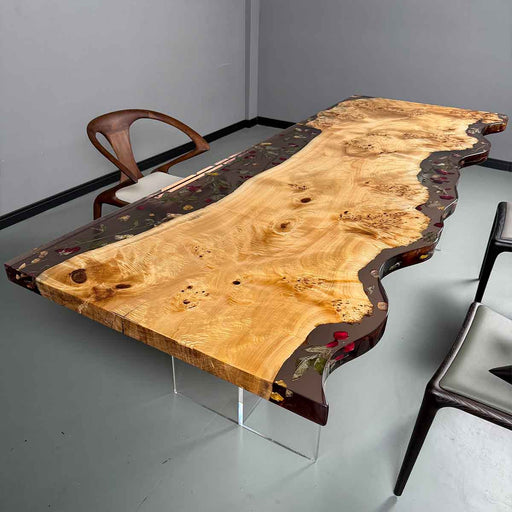 Wooden dining table with a unique design in a room with chairs.