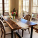 Dining room with a wooden table, chairs, and decorative items.