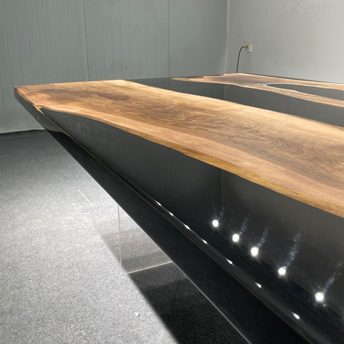 Modern black bathtub with wooden countertop in a minimalistic setting