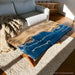 Handmade blue resin epoxy dining table featuring solid poplar wood and ocean wave details for luxury kitchen and dining furniture