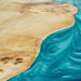 Wood slab coffee table with blu epoxy resin filling.