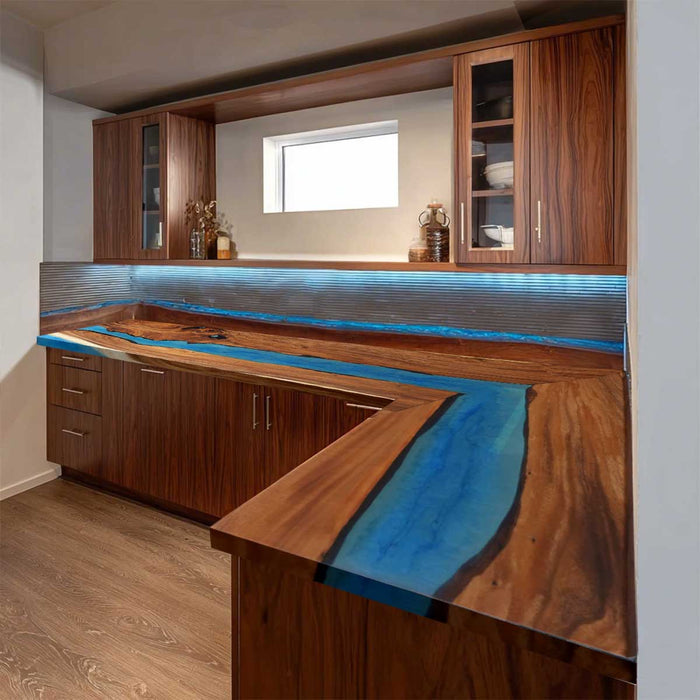 Handmade L-shaped kitchen countertop showcasing walnut grain and mysterious blue epoxy