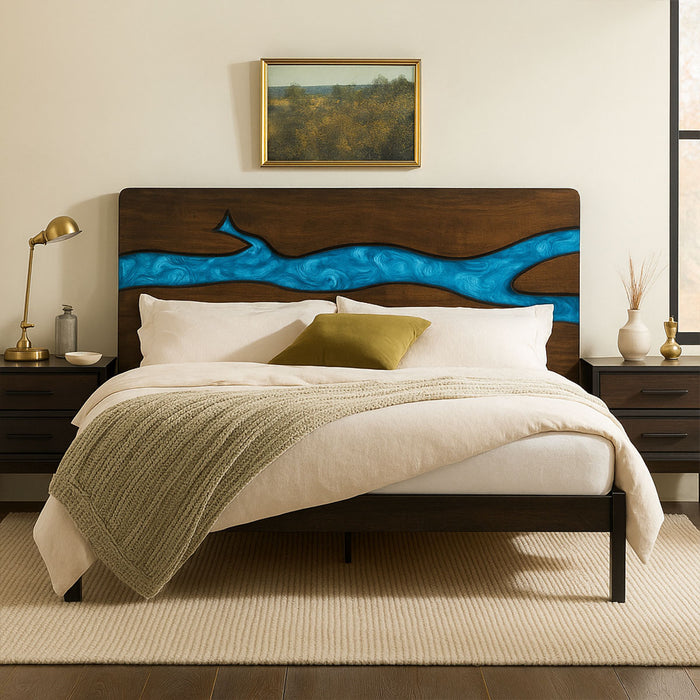 Bedroom with a wooden bed featuring a blue river design, white bedding, and decorative pillows.