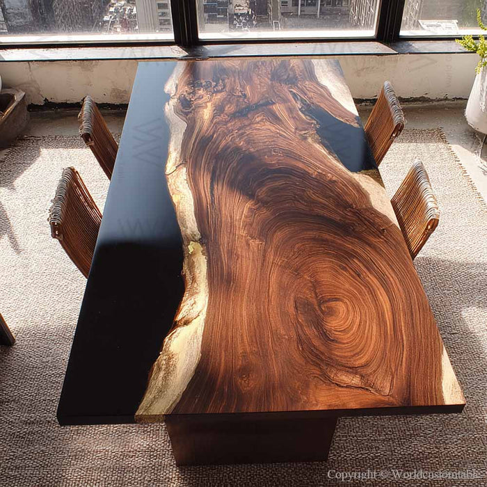Handmade live edge walnut table combined with sleek black epoxy resin.