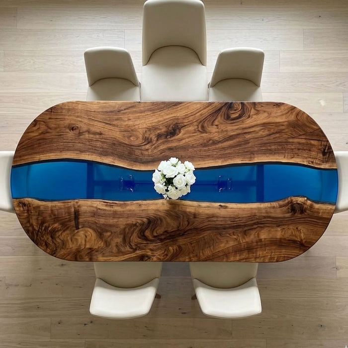 Top view of a handcrafted oval table showcasing the rich wood grain of American black walnut and blue resin art.