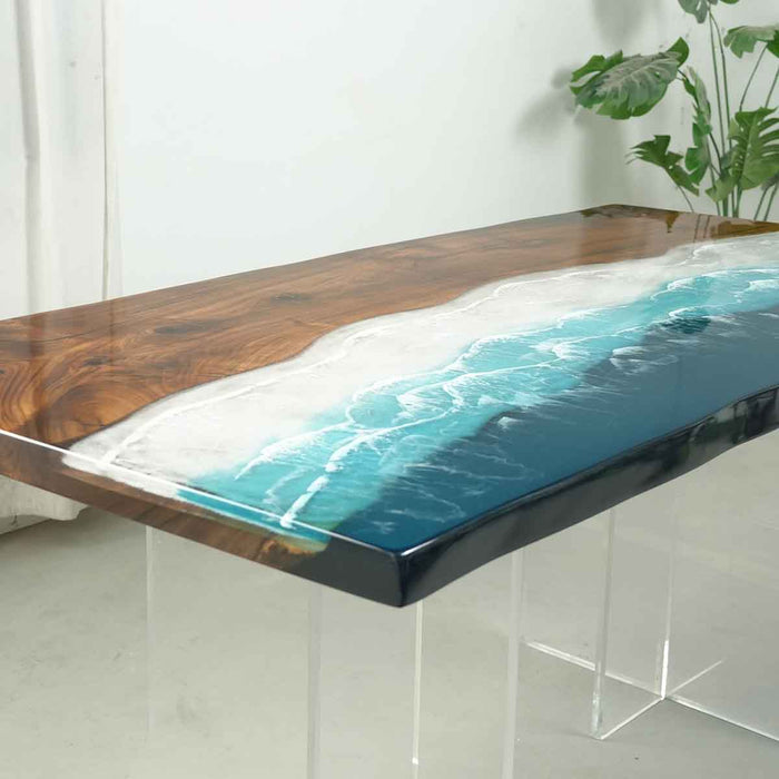 Wooden table with a blue resin river design on a white background