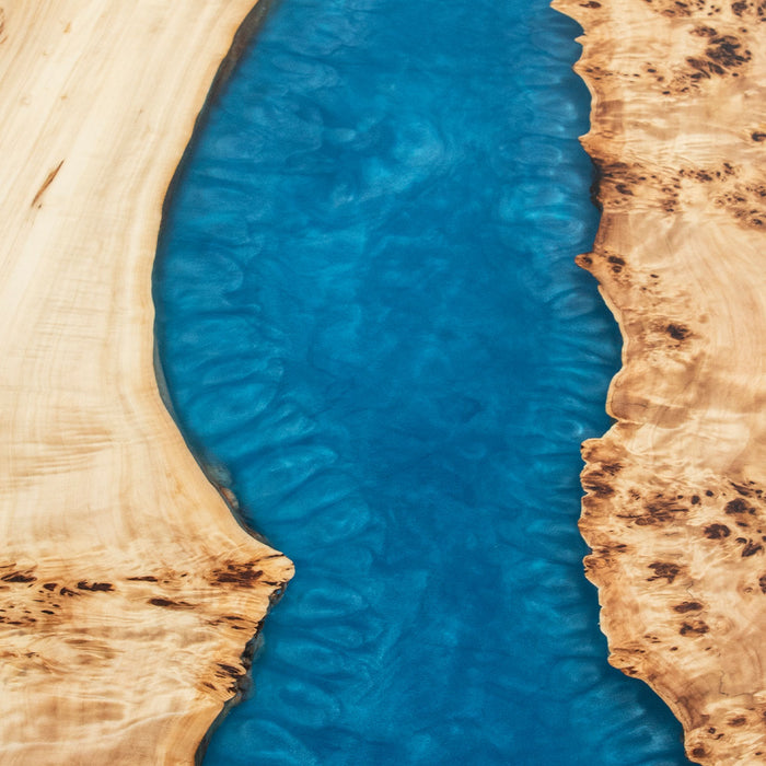 Handmade conference table with poplar slabs and a striking blue epoxy river