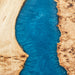 Handmade conference table with poplar slabs and a striking blue epoxy river